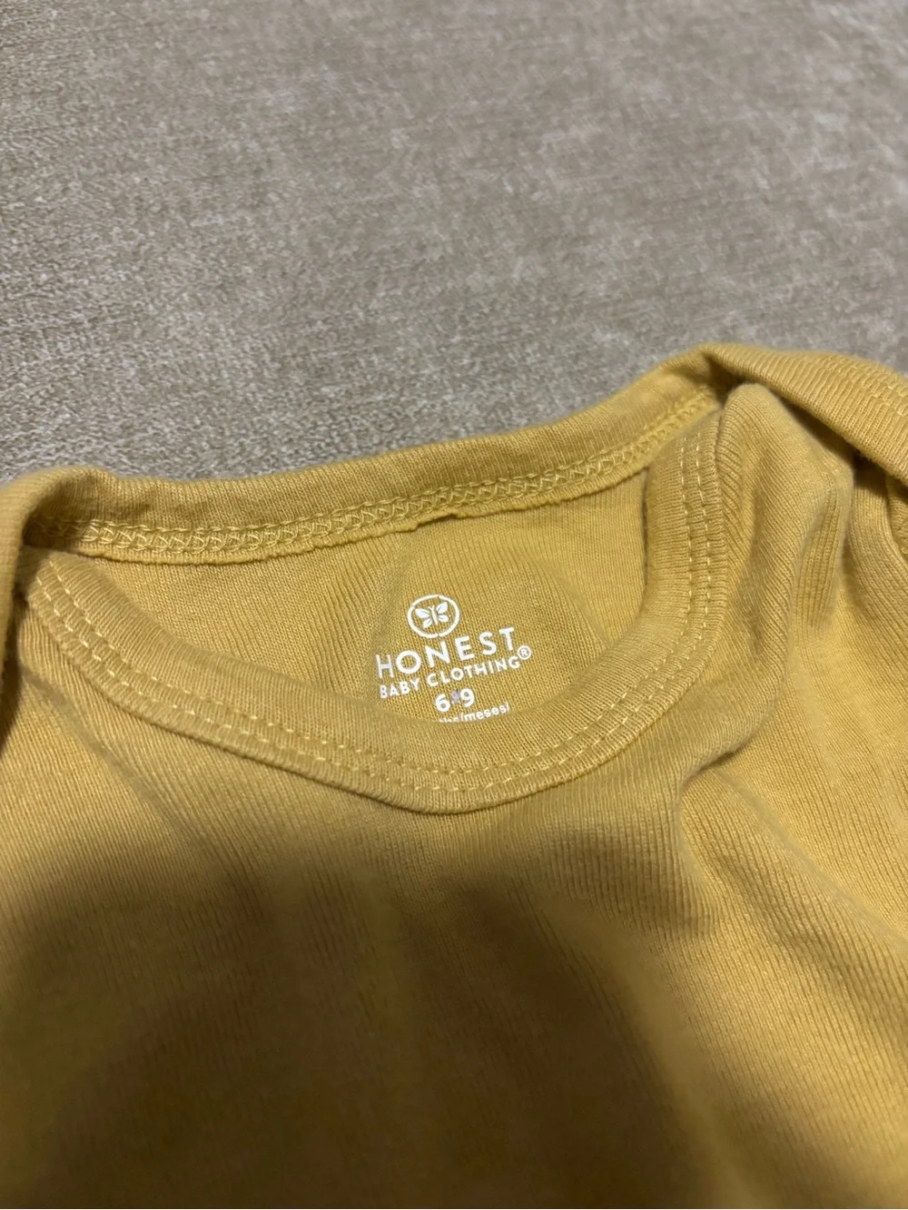 The Honest Company Mustard Long-Sleeve Baby One-Piece